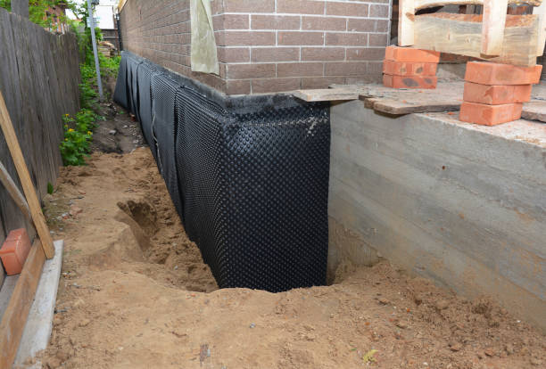 SJ Waterproofing Pros technician performing targeted Waterproofing assessment in Woodville, VA